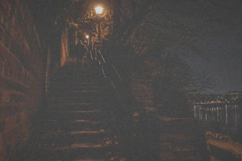 A wide view of the Exorcist Steps staircase in Georgetown at night